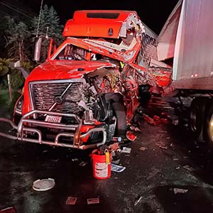 photo showing damaged tractor trailer truck